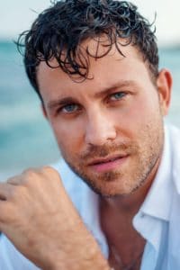 Handsome man with wet hair at seaside