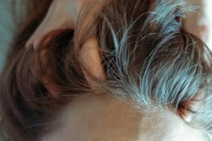 Relaxing massage. SPA treatments for head. Close-up of cosmetic procedures. Woman enjoying massage.